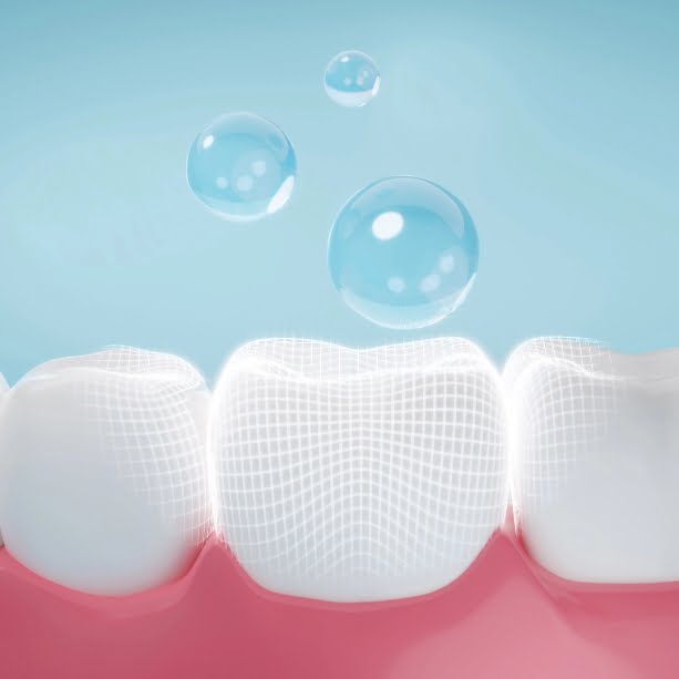 Drop of fluoride coating teeth and gums metaphor oral hygiene, cleaning teeth and gums. 3D rendering